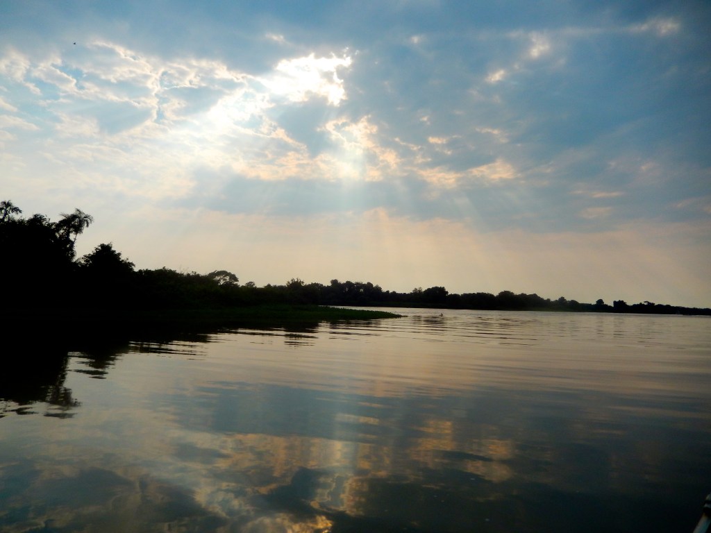 Rays of sun burst through the clouds in the early morning light