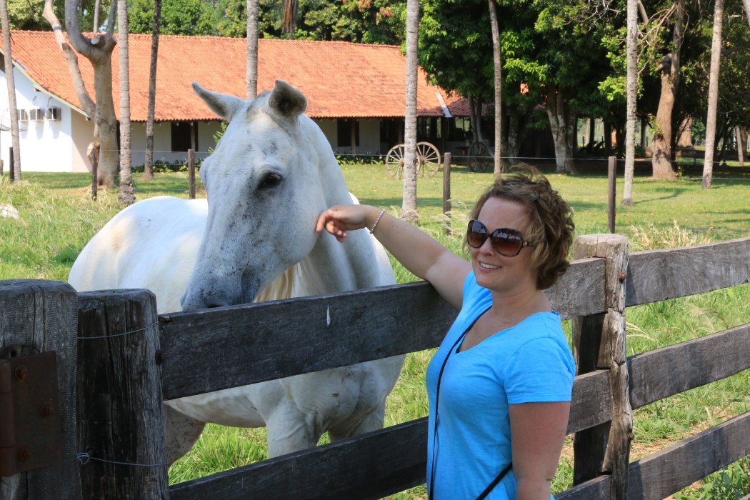 Petting a horse on the farm and thankful to be on land