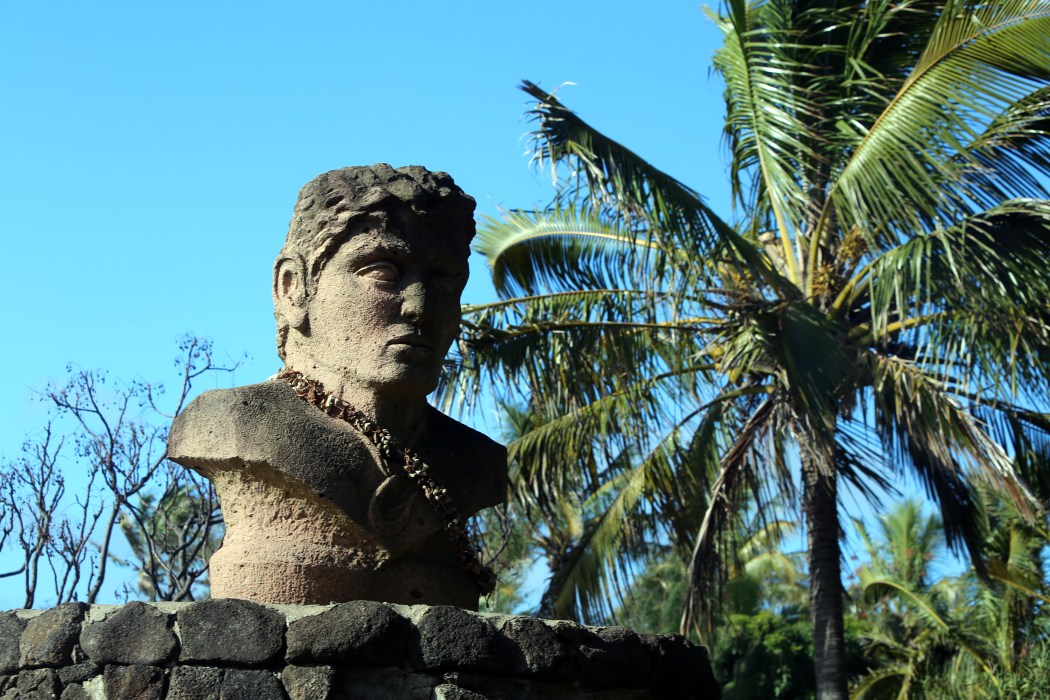 Cool statues and palm trees abound