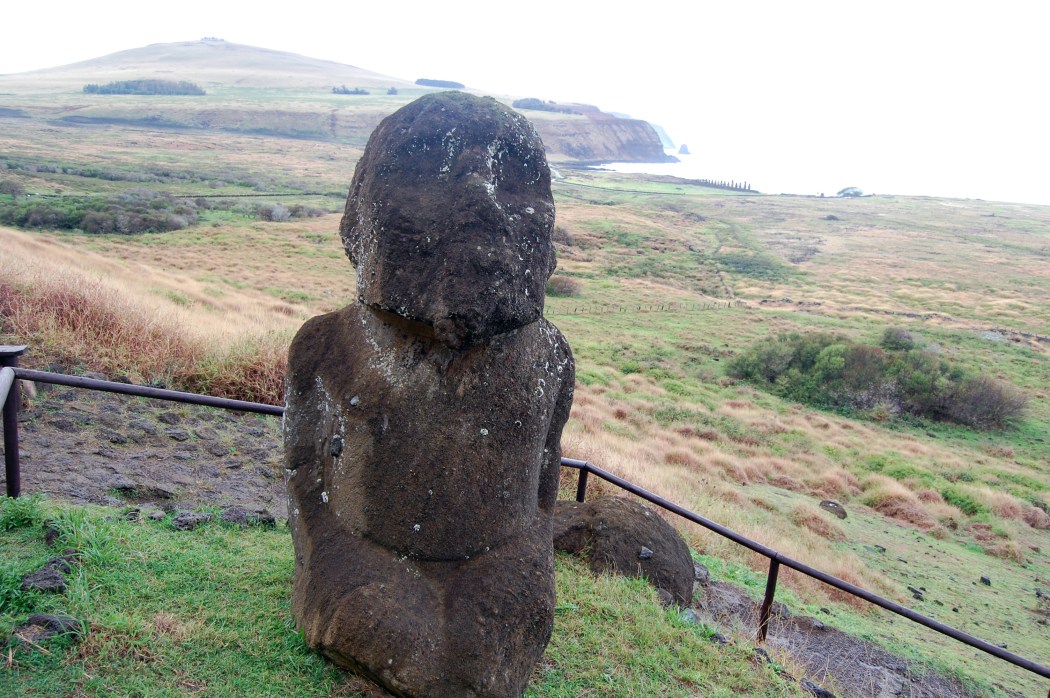 Tukuturi statue at the top of the hill.  The statue is of a kneeling hermaphrodite, and you can see remote Poike Peninsula and Ahu Tangariki in the background